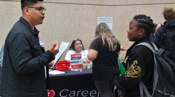 HEB Representative with students - full-size