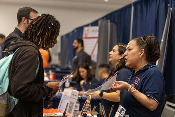 Student learning about on-campus jobs with at UTSA department