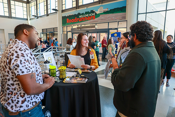 Students talking with school district representatives
